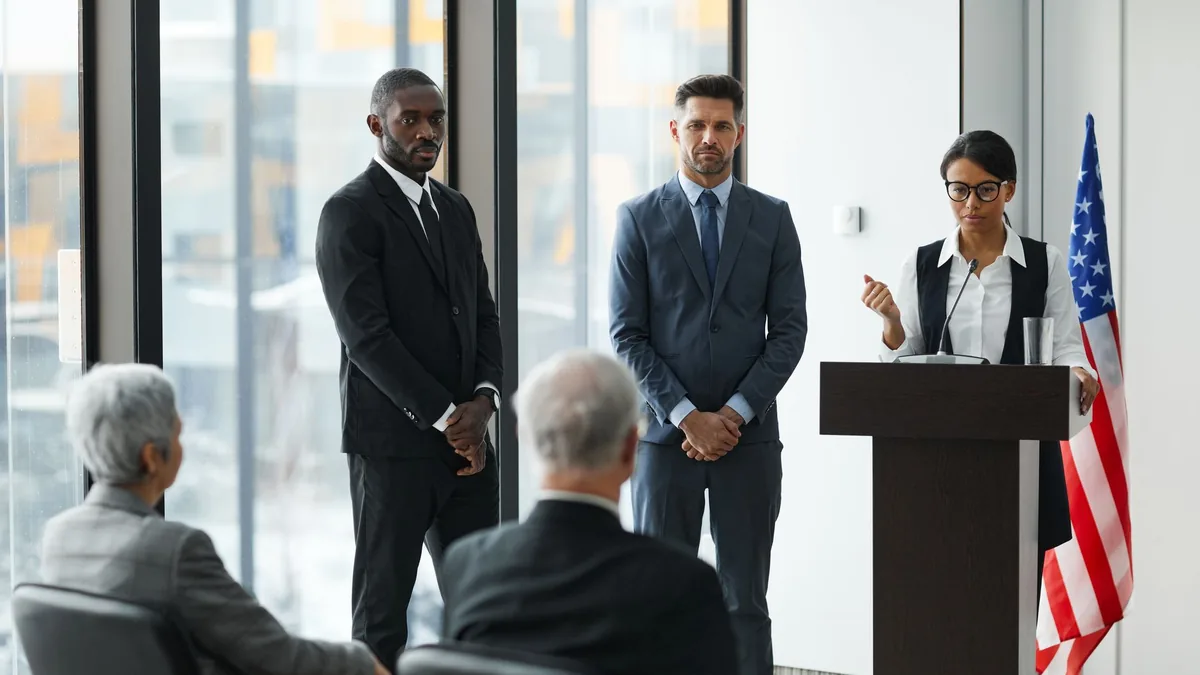 Professional speakers presenting at a conference in a mo