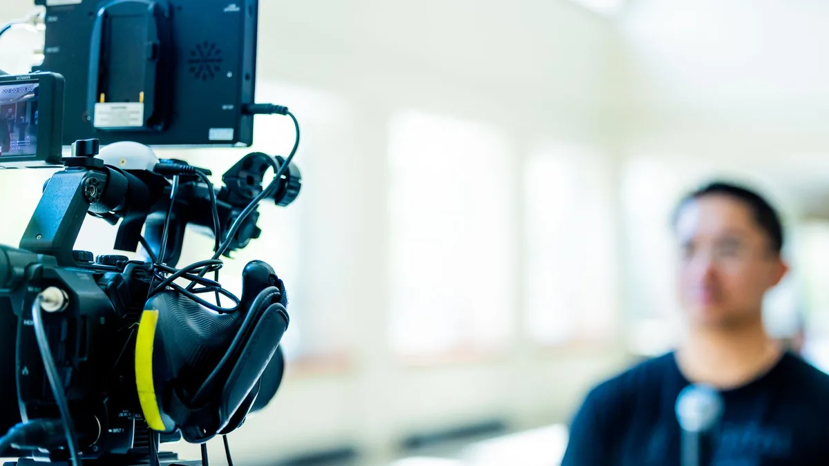 Professional video camera setup focusing on an interview