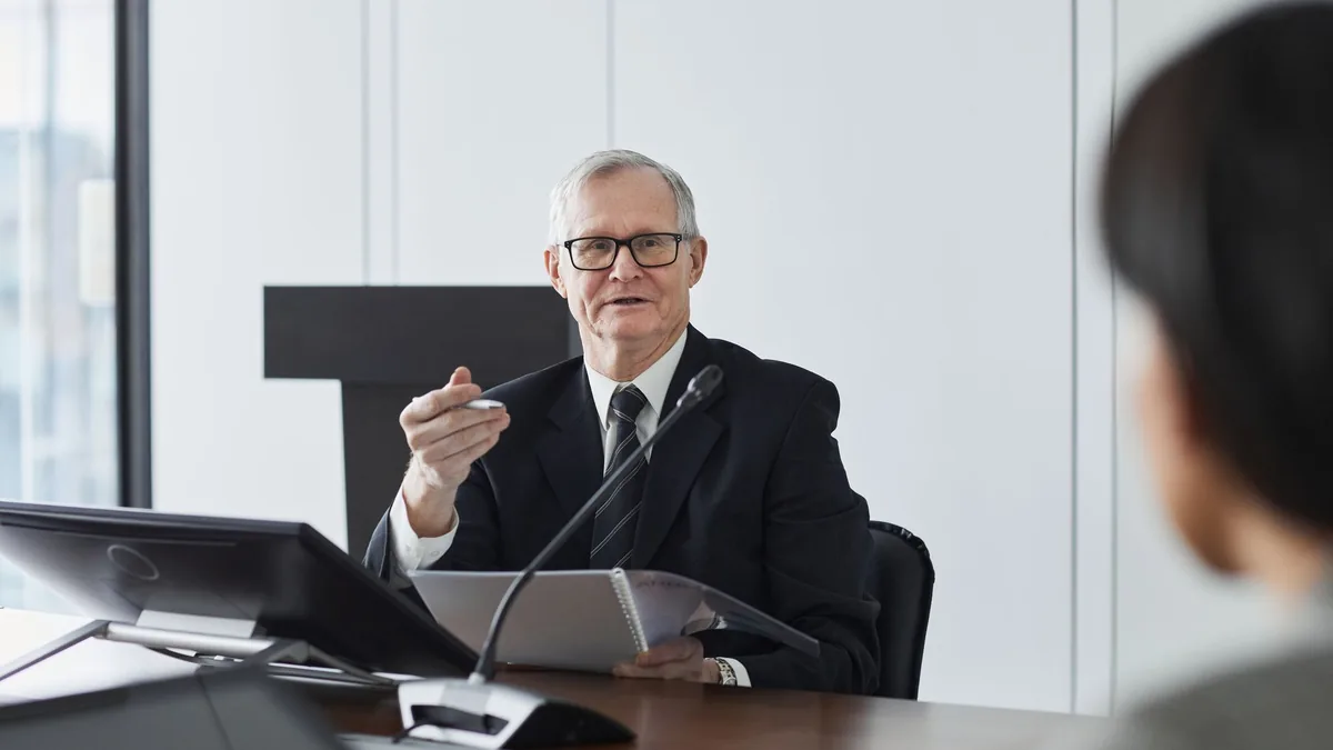 Senior businessman leading a professional discussion in