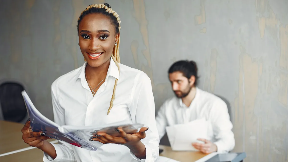 Smiling professionals in a modern office showcasing dive