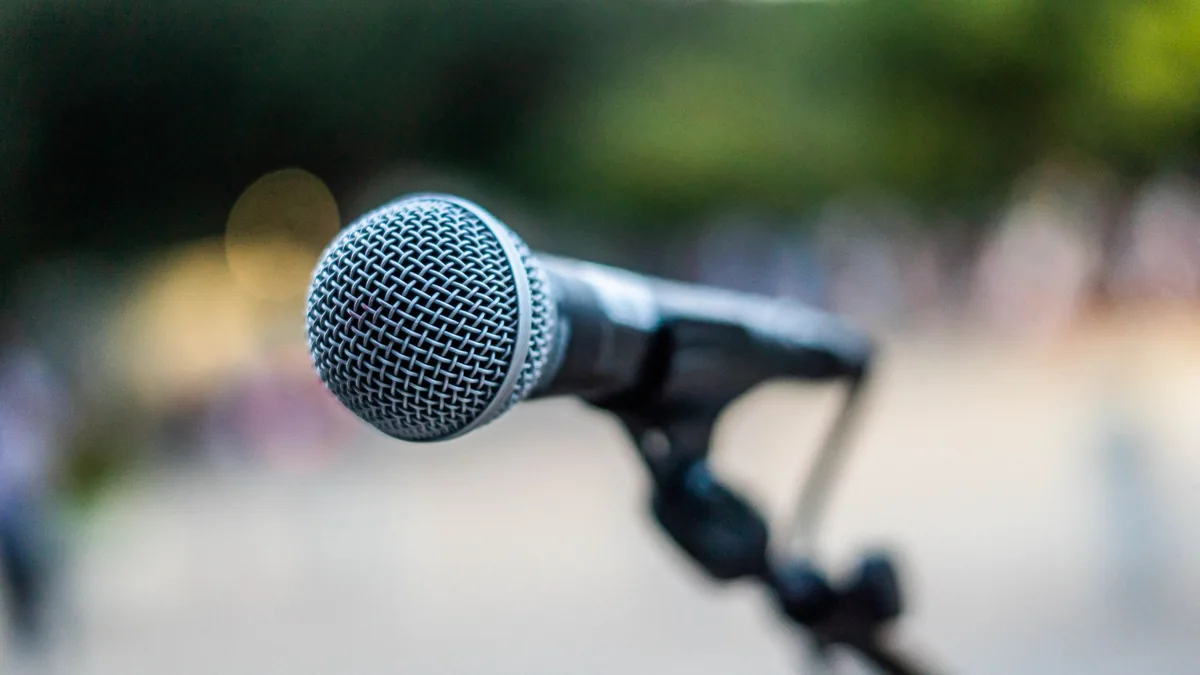 Soft focus of contemporary microphone on holder placed o