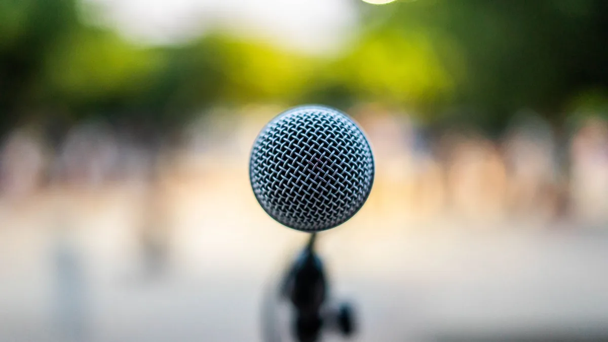 Soft focus of modern microphone located on stage during