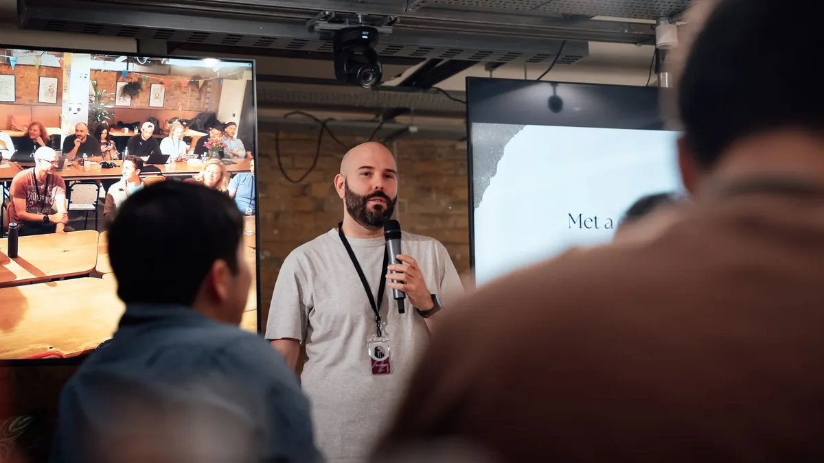 Speaker addressing audience at a london event engaging a