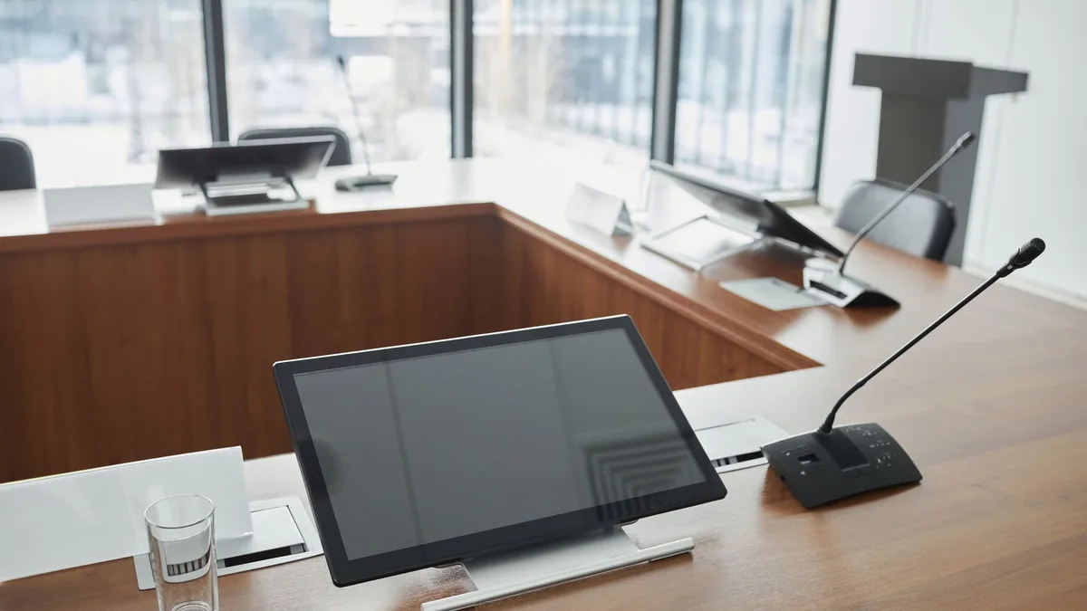 Stylish meeting room setup featuring digital screens and