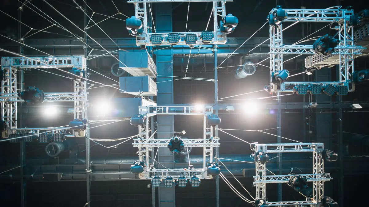 Top view of digital screen under ropes and metal constru