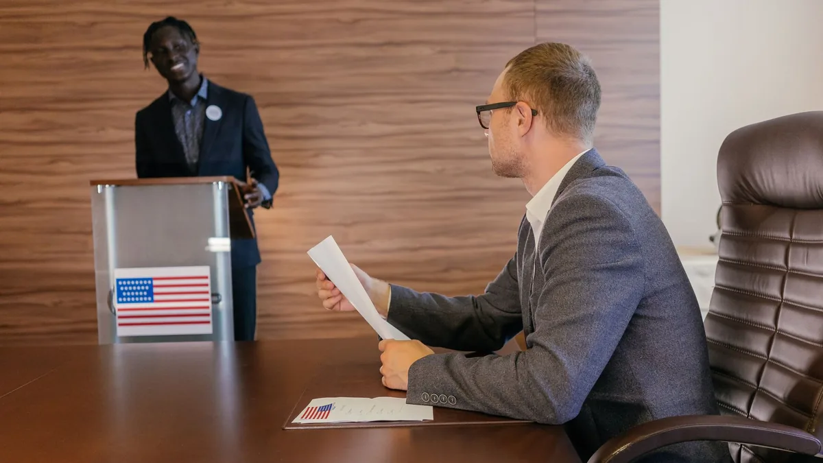 Two professionals in discussion during a political meeti