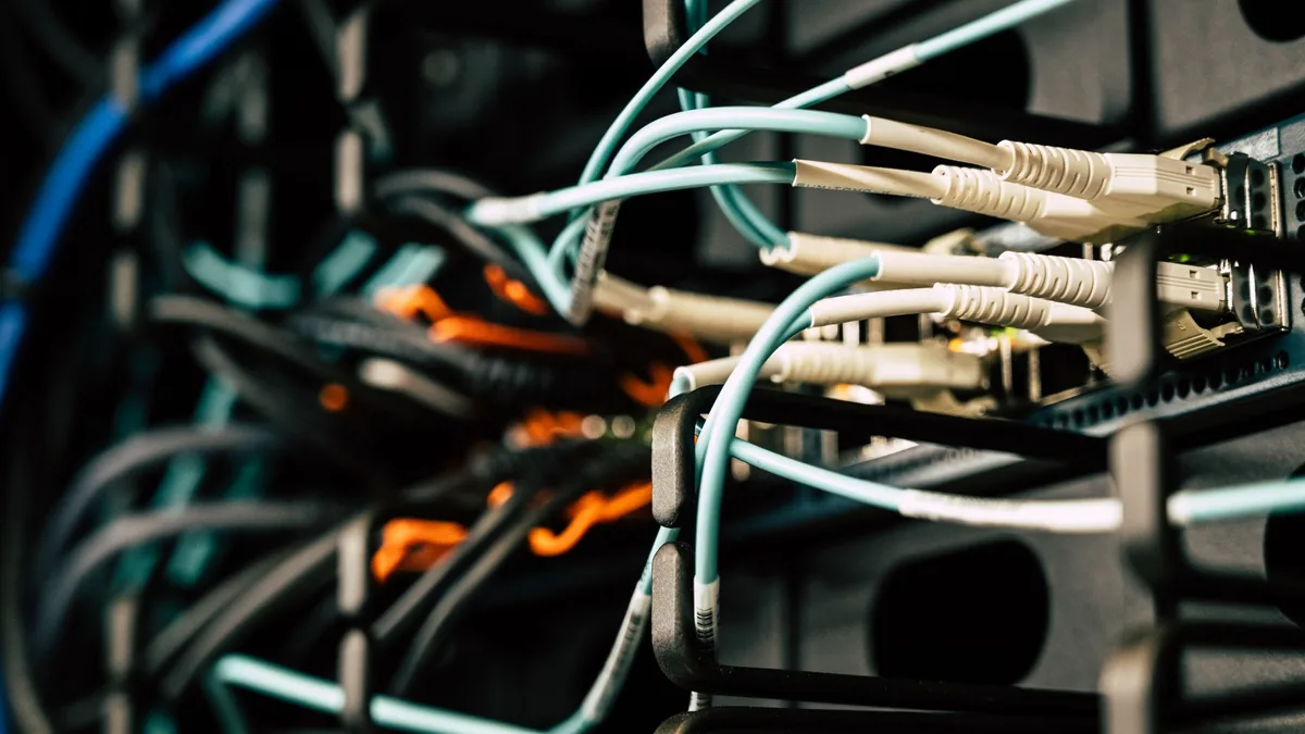Various tangled wires connected to system near black met