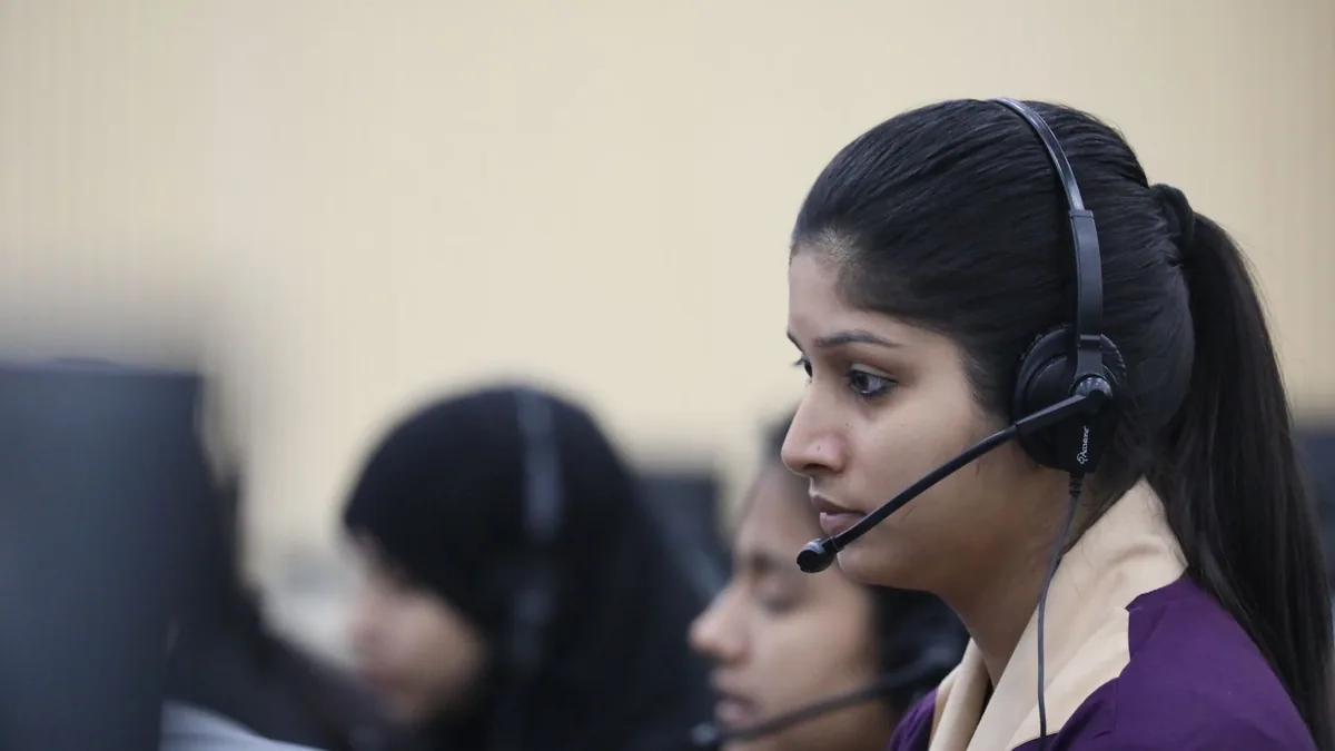Young asian woman working attentively as a call center a